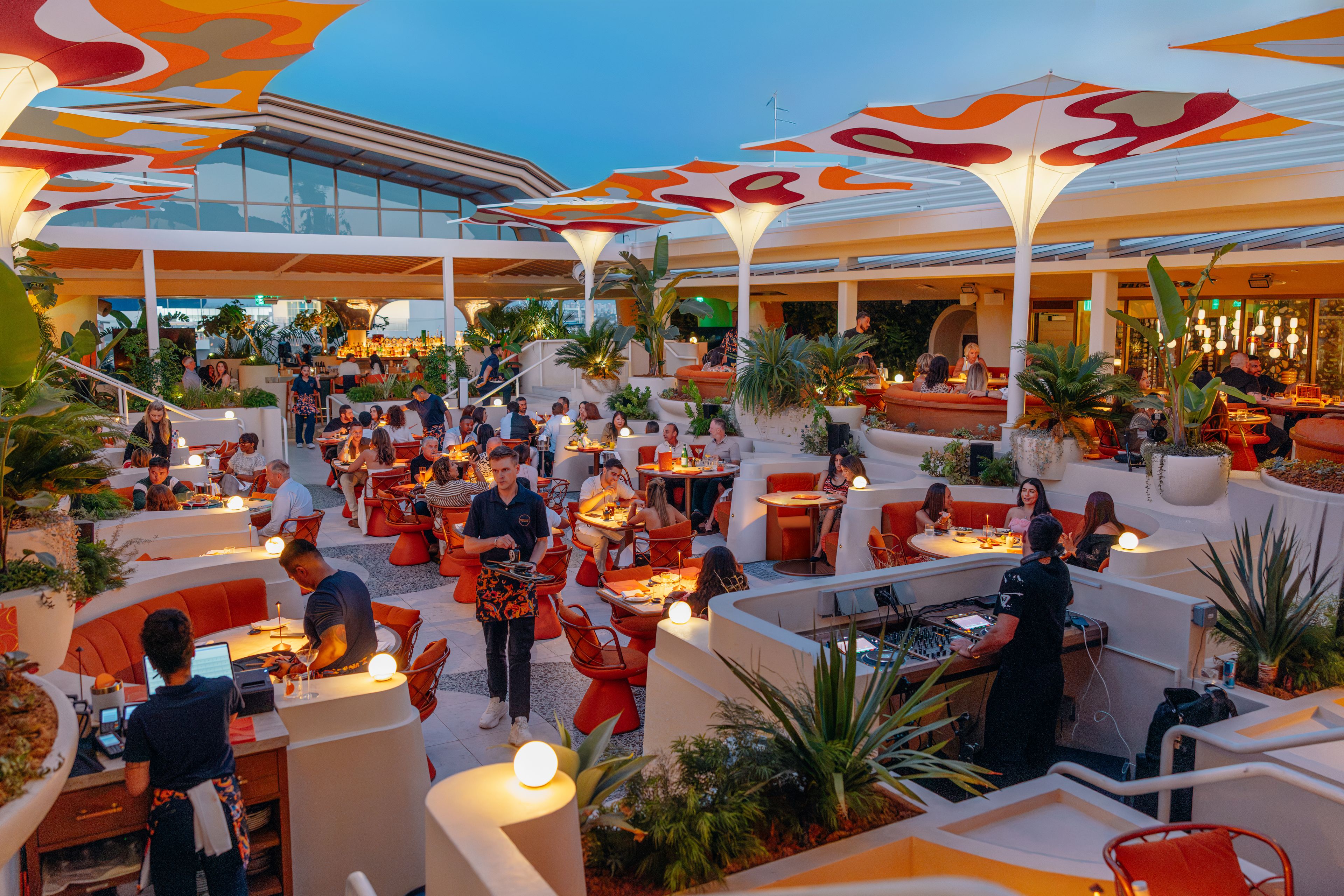 SUSHISAMBA LOS ANGELES dining room at dusk with a DJ