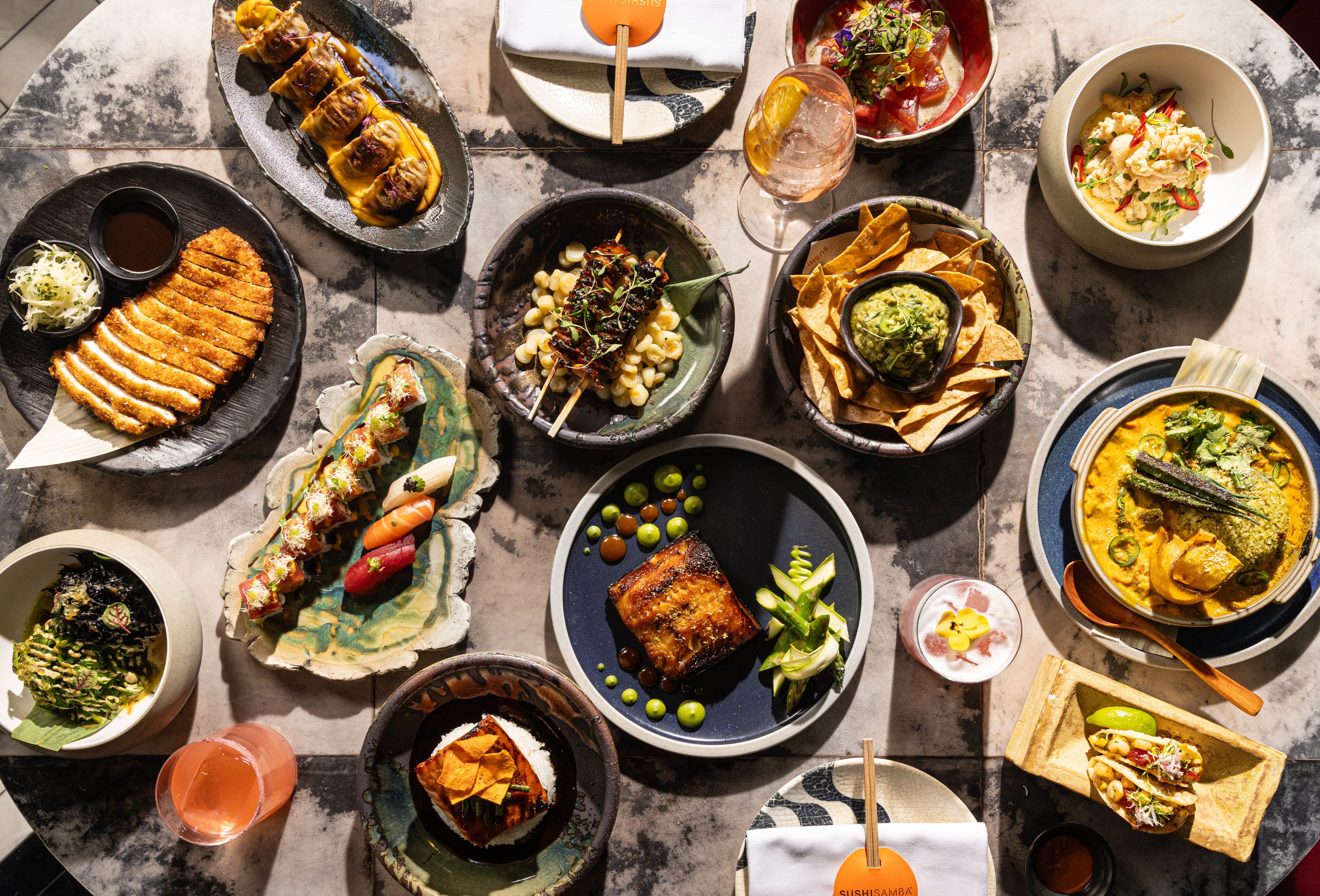 SUSHISAMBA Covent Garden A table filled with dishes from the Vivo Menu.