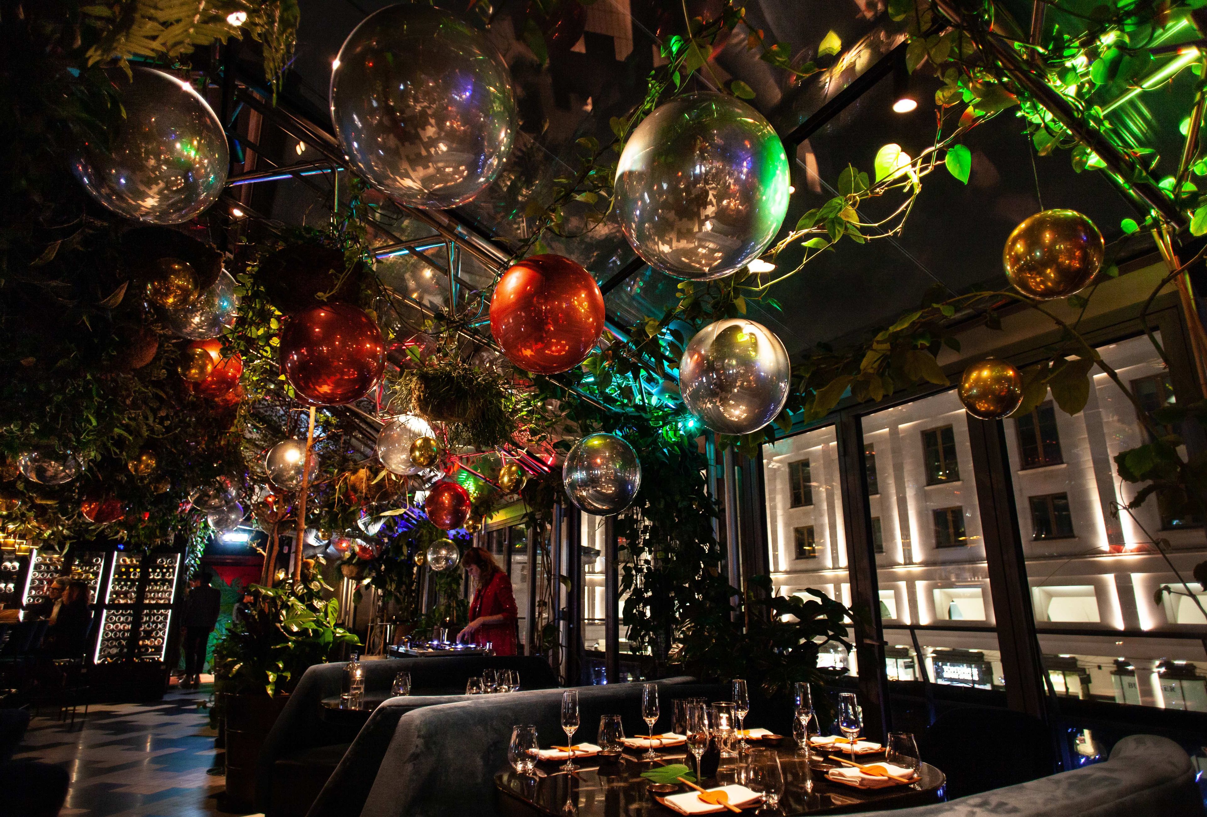 SUSHISAMBA Covent Garden Festive Decorations. Image shows foil balloons hanging from the ceiling